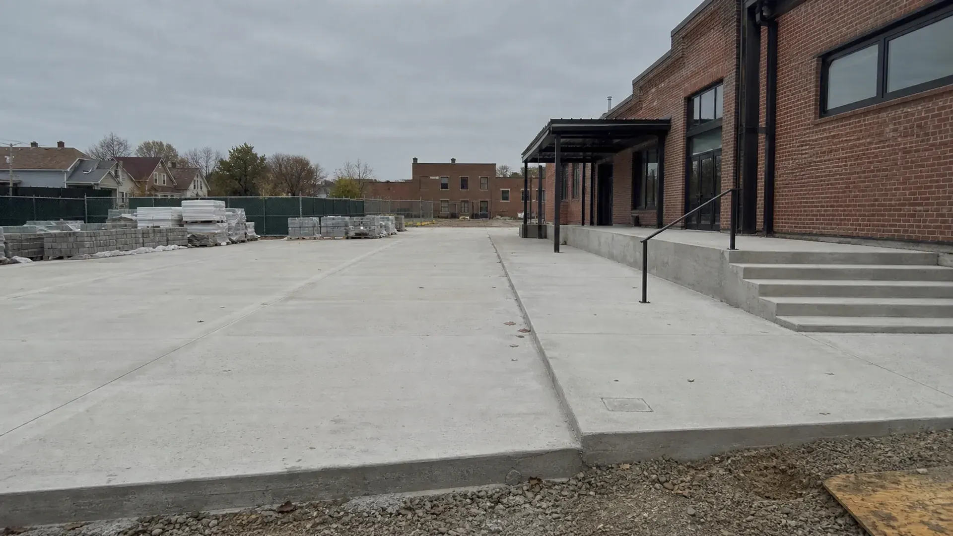 Substantial concrete flatwork, steps, and access improvements at a Greater St Louis brick property.
