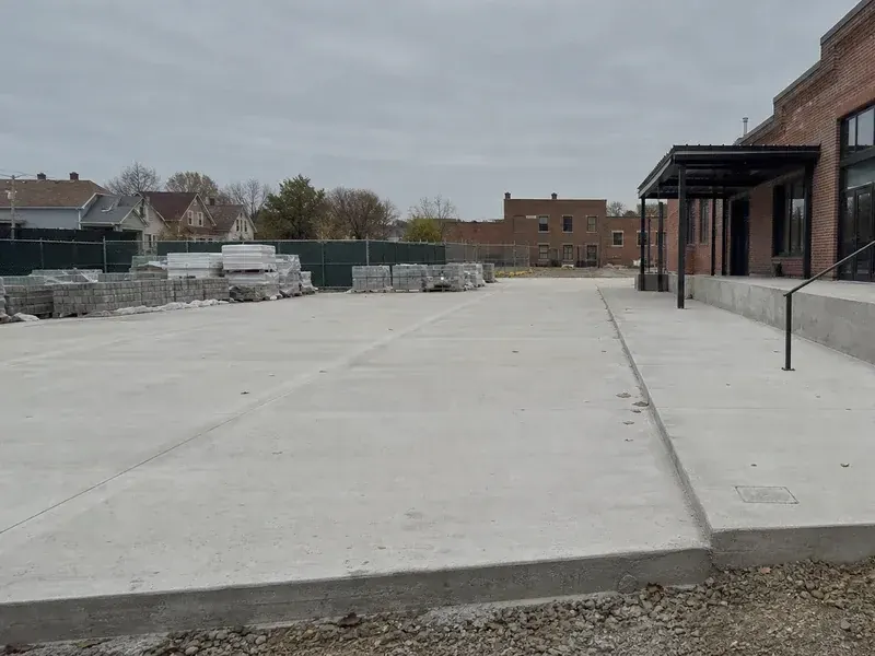 Substantial concrete flatwork, steps, and access improvements at a Greater St Louis brick property.